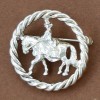 broche ronde avec cheval de dressage