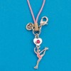 pink layback ice skating bag charm
