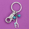 porte-clefs gymnaste souplesse arrière bleue