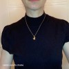 two tiny ice skating boots pendant
